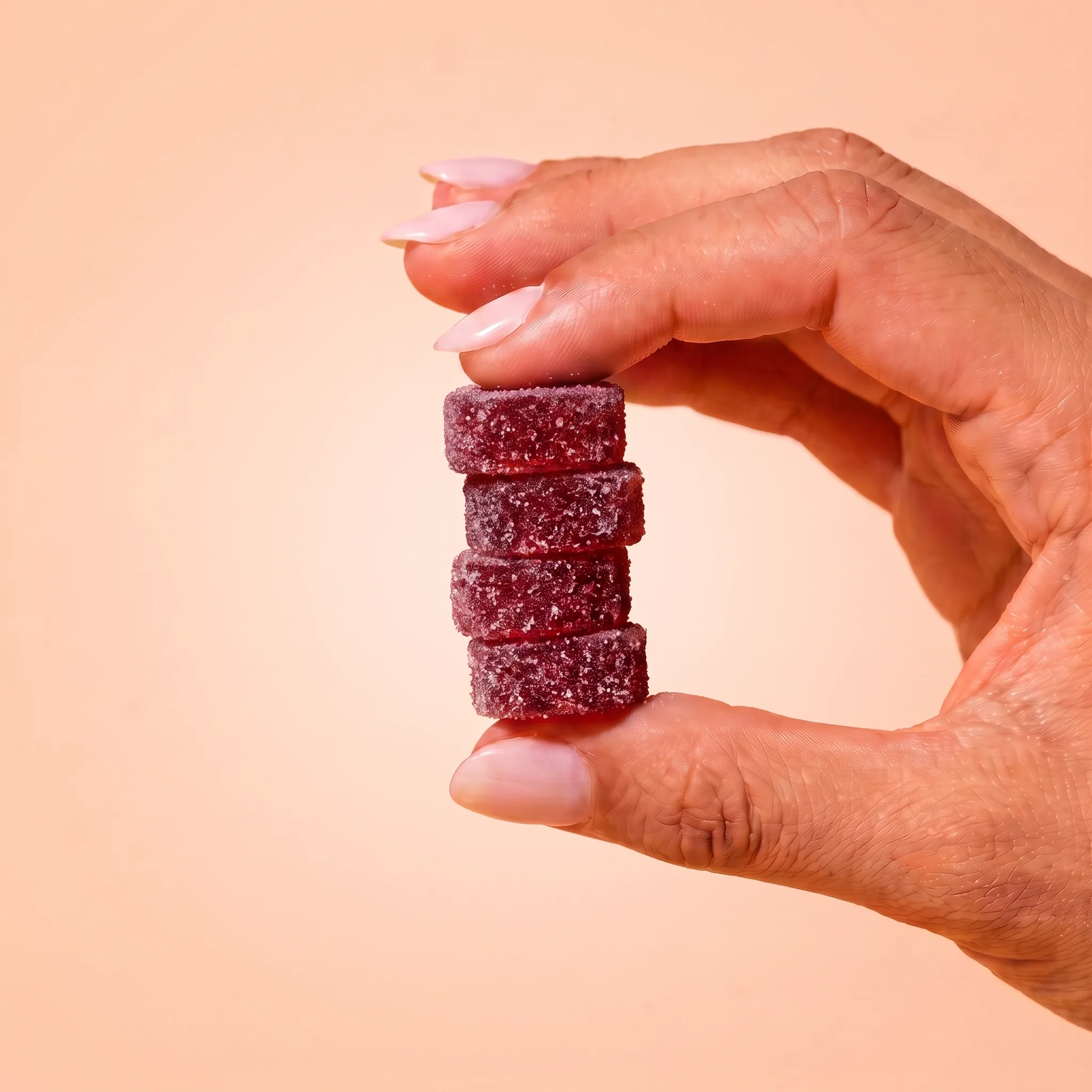 Hand holding Sunshine Bliss gummies